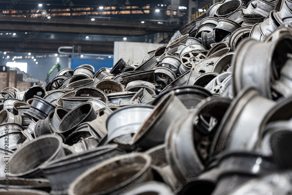 Aluminum rims and cans stacked for recycling