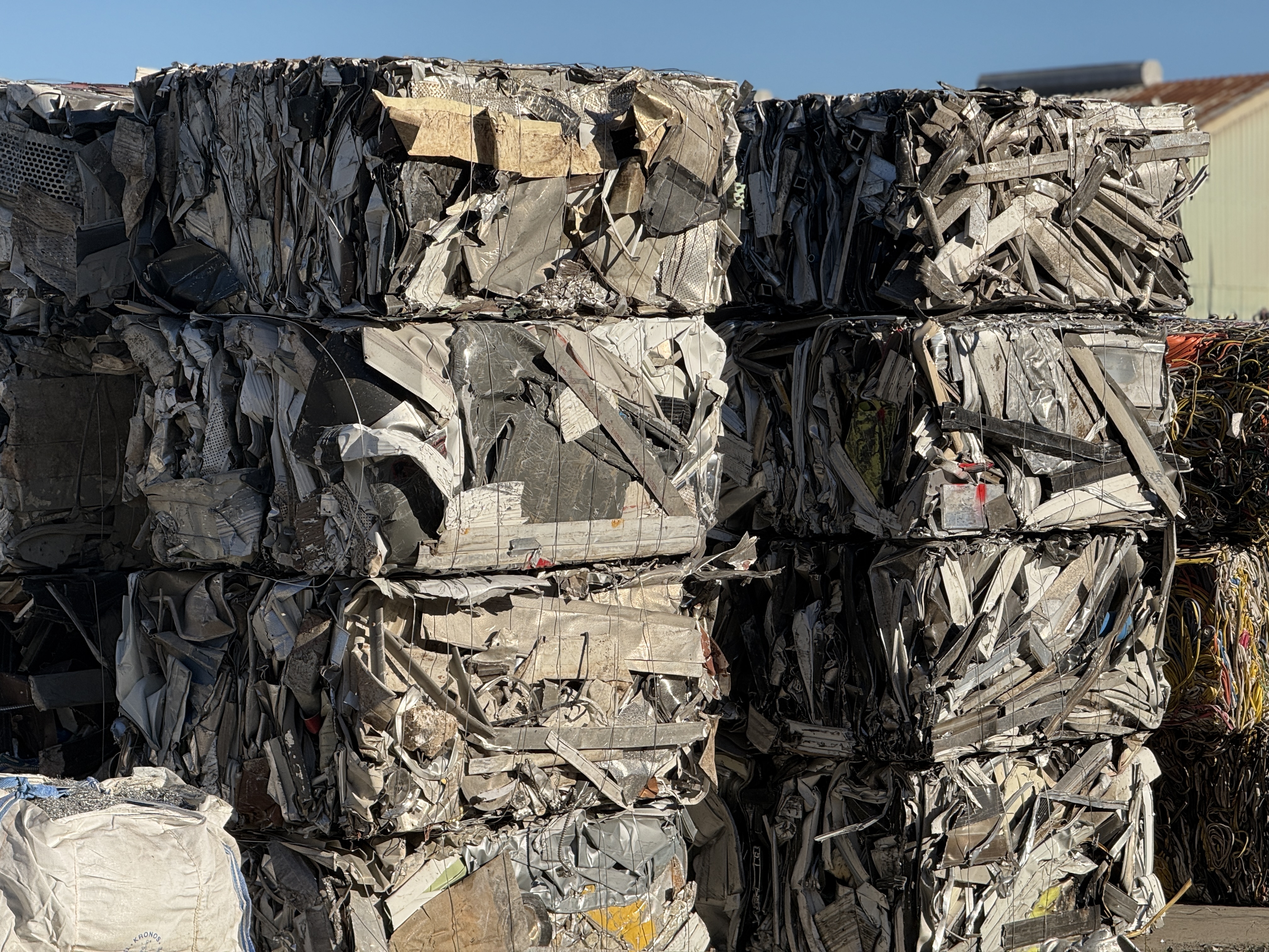 Aluminum bales neatly organized staged for shipping to the mill