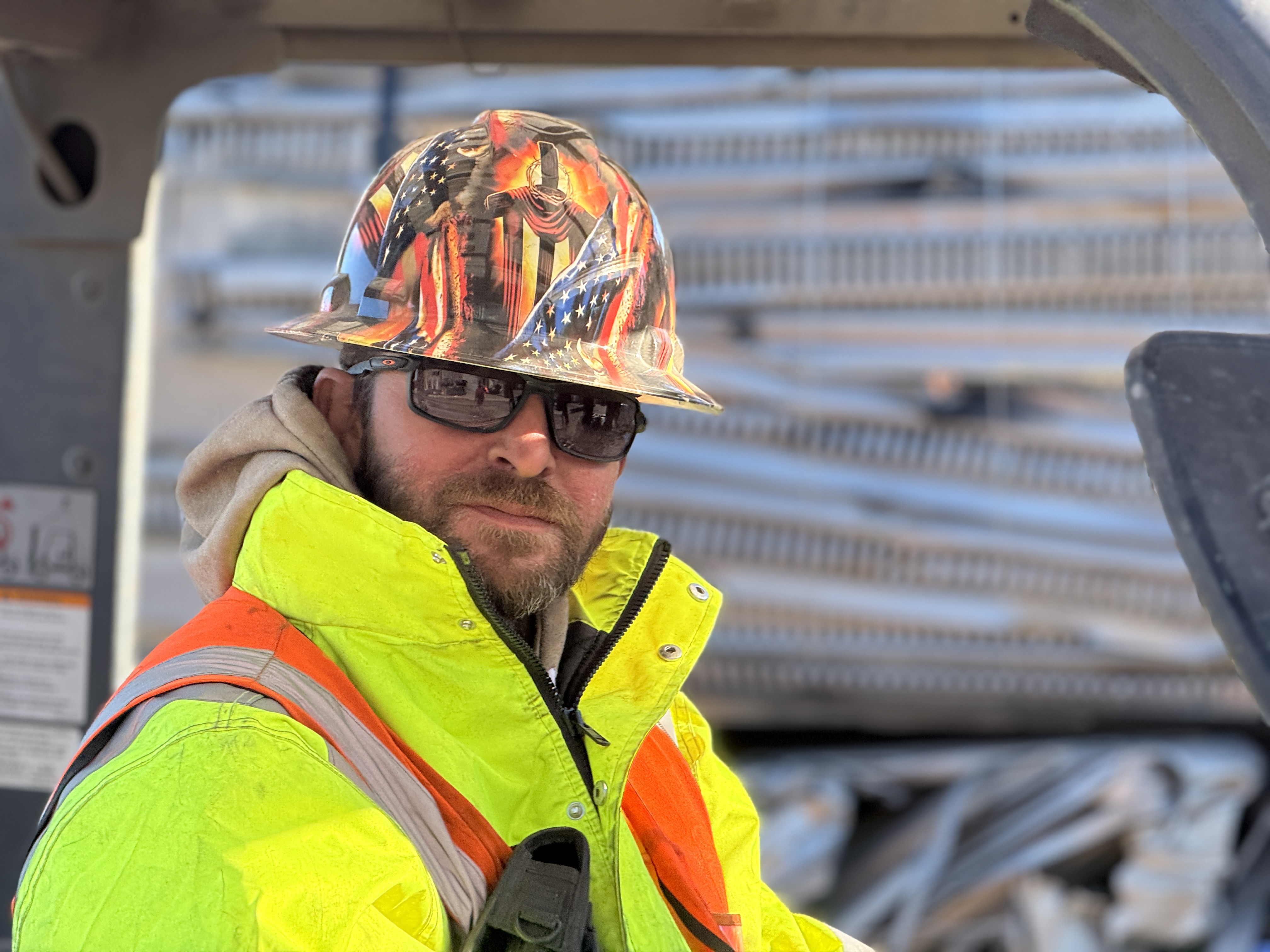 Forklift operator waering PPE and High Viz Jacket
