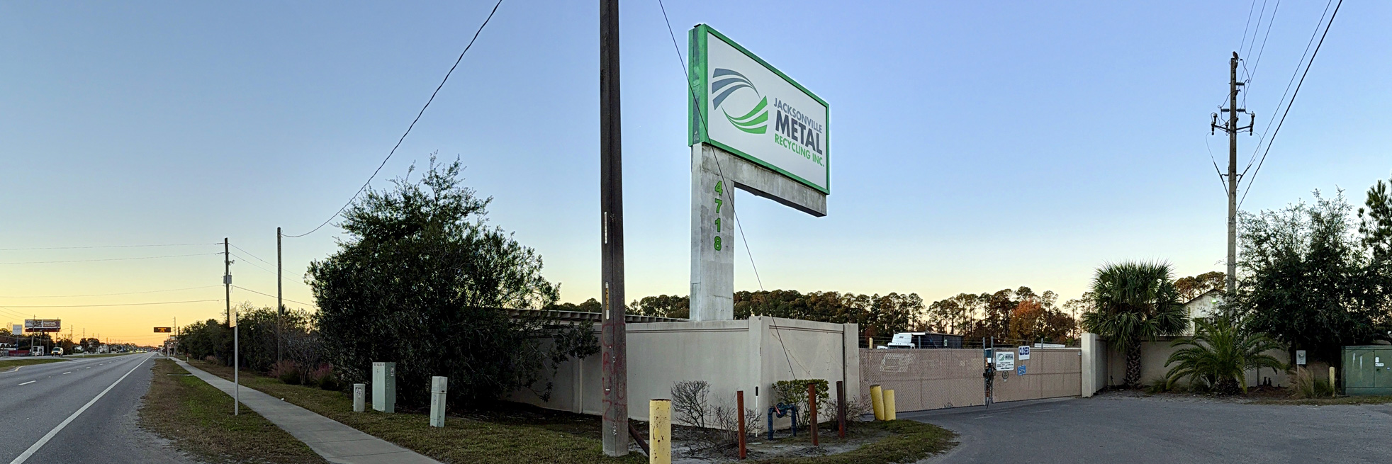 Overview of Jacksonville Metal Recycling yard with scrap metal and equipment